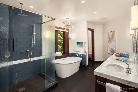 a bathroom with a sink toilet and shower