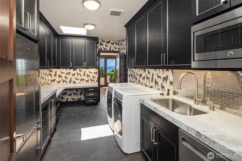 a kitchen with a sink and a refrigerator