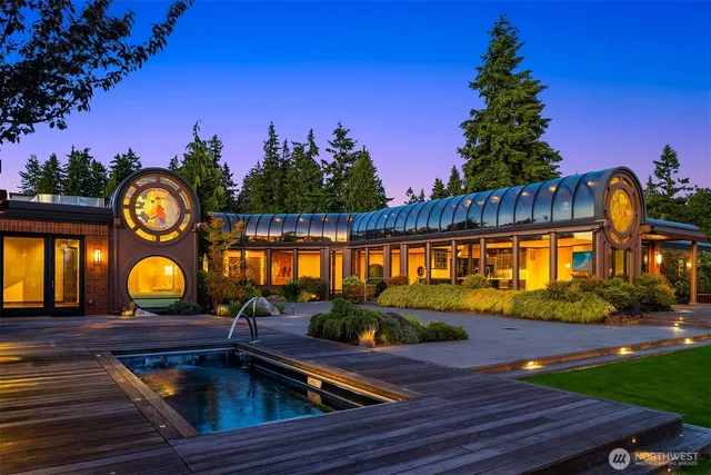 swimming pool view with plants and outdoor seating