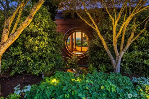 a view of a table and chairs in the garden