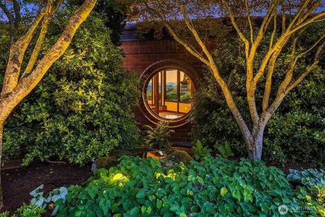 a view of a table and chairs in the garden