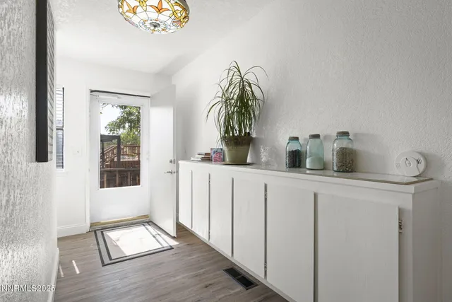 a bedroom with a bed and a table