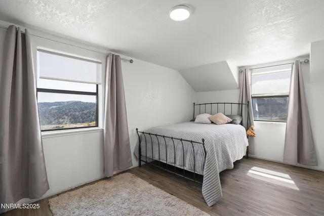 an aerial view of a houses with a street