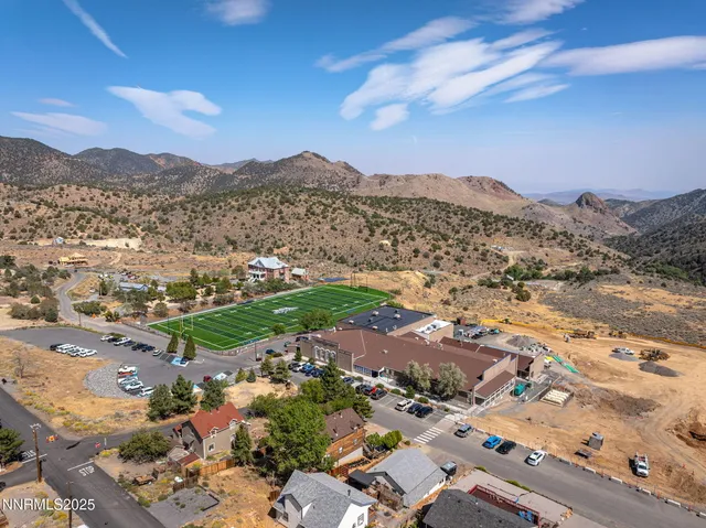 an aerial view of residential houses with outdoor space