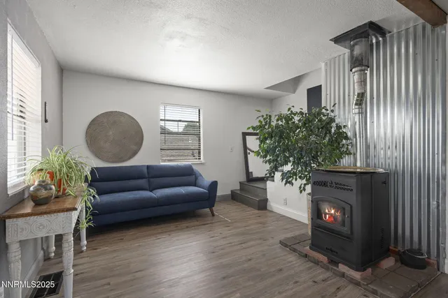 a kitchen with a table chairs and a refrigerator