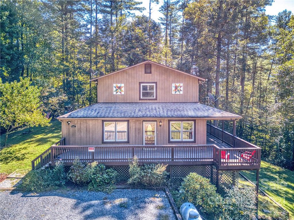 885 Rustic Heights Road Waynesville, NC 28785 - Photo 3 of 32 a front view of a house with a yard