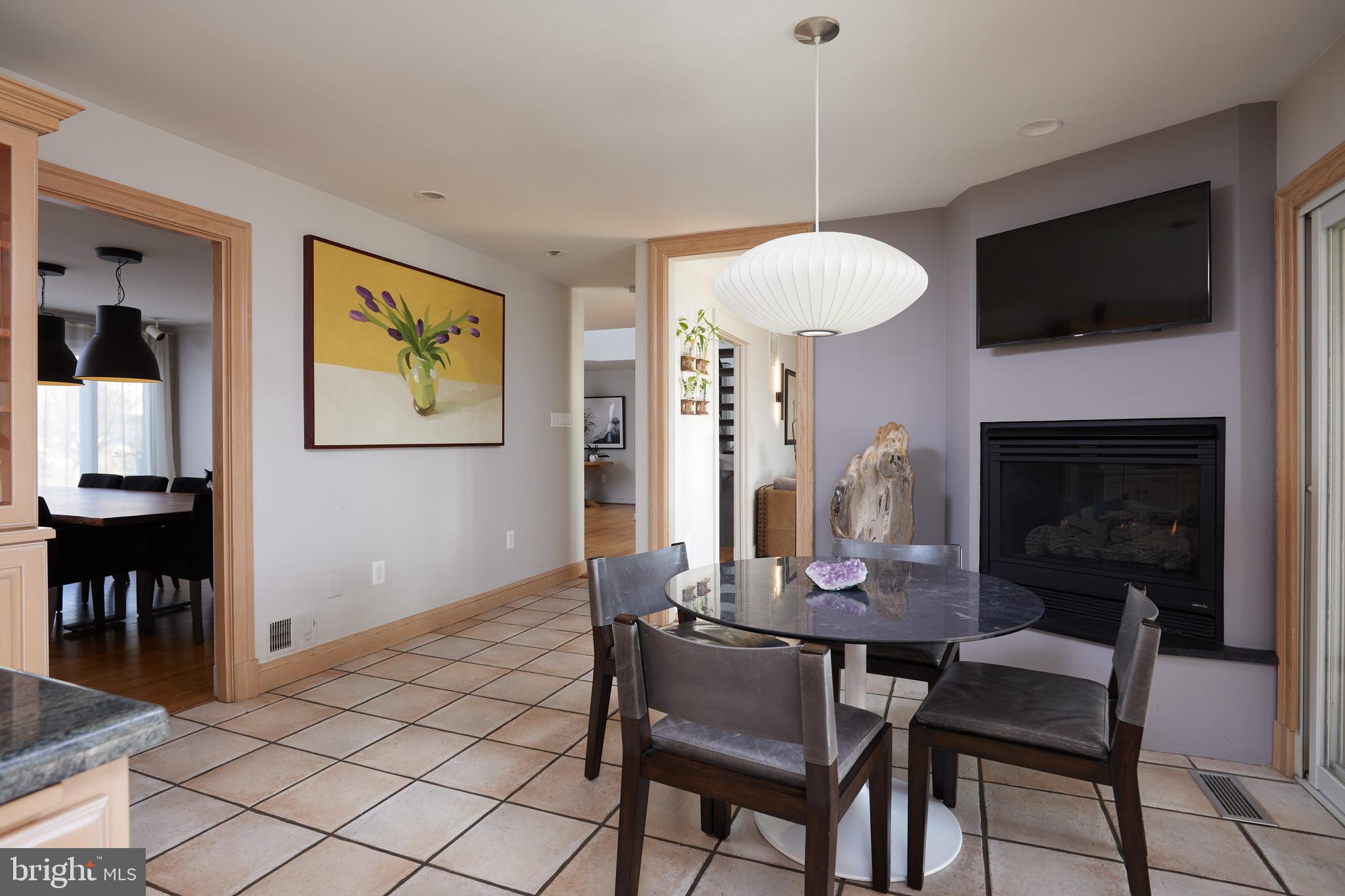 9904 Bluegrass Road Potomac, MD 20854 - Photo 20 of 68 Table space kitchen with fireplace.