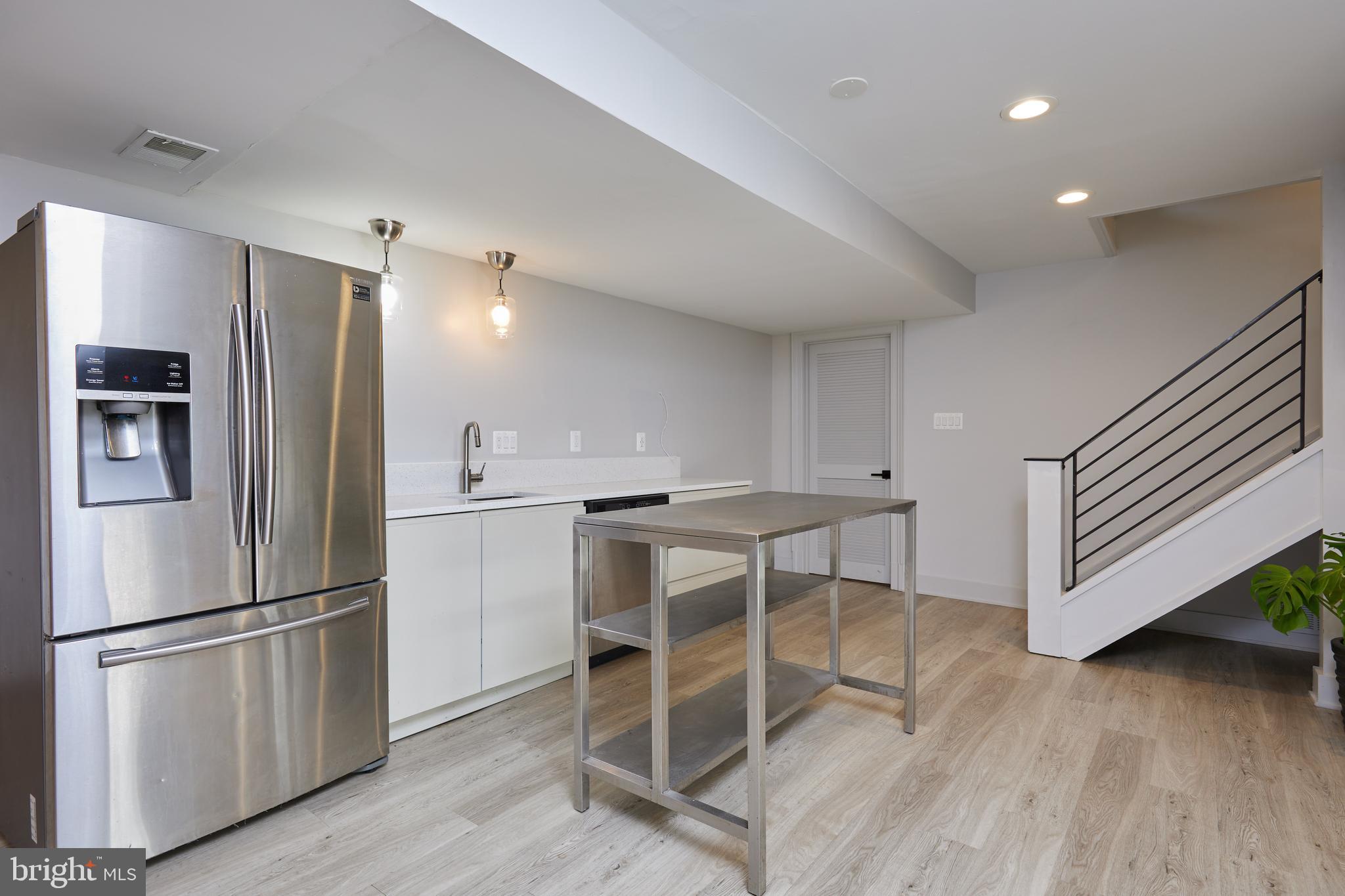 9904 Bluegrass Road Potomac, MD 20854 - Photo 51 of 68 Lower level kitchenette! Laminated flooring.