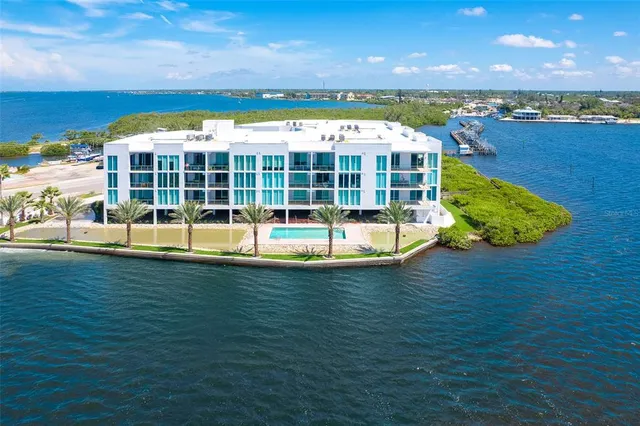 a view of a swimming pool with an outdoor seating