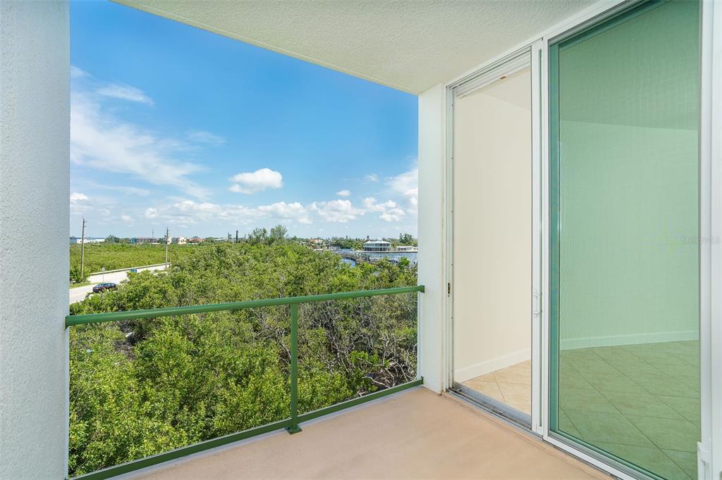 1375 Beach Road, Unit 210 Englewood, FL 34223 - Photo 13 of 49 a view of a glass door and a window