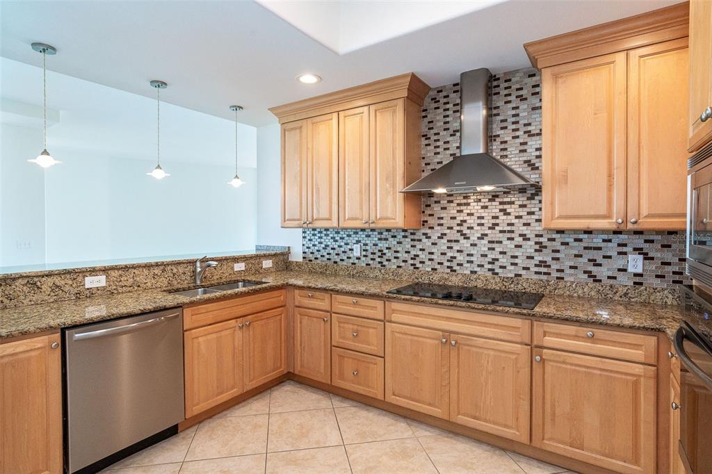 1375 Beach Road, Unit 210 Englewood, FL 34223 - Photo 22 of 49 a kitchen with a sink and cabinets
