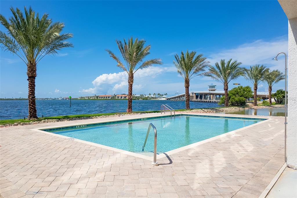 1375 Beach Road, Unit 210 Englewood, FL 34223 - Photo 3 of 49 a swimming pool with outdoor seating and yard