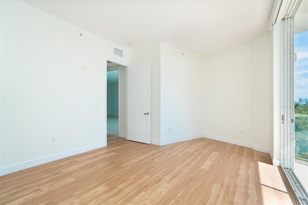 1375 Beach Road, Unit 210 Englewood, FL 34223 - Photo 35 of 49 a view of empty room with wooden floor