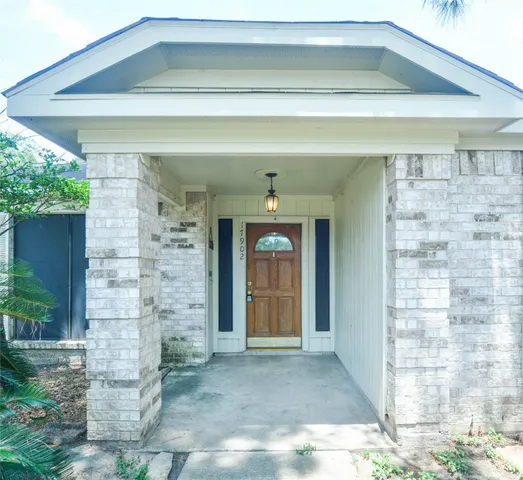 a front view of a house with a glass door