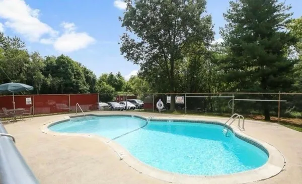 a view of a swimming pool with a sitting space