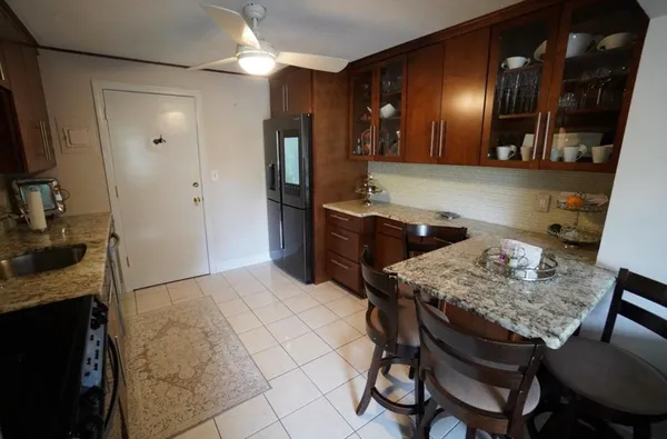 a kitchen with a table and chairs in it