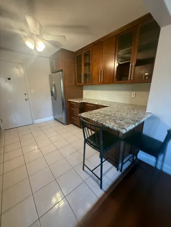 a view of kitchen with furniture and window
