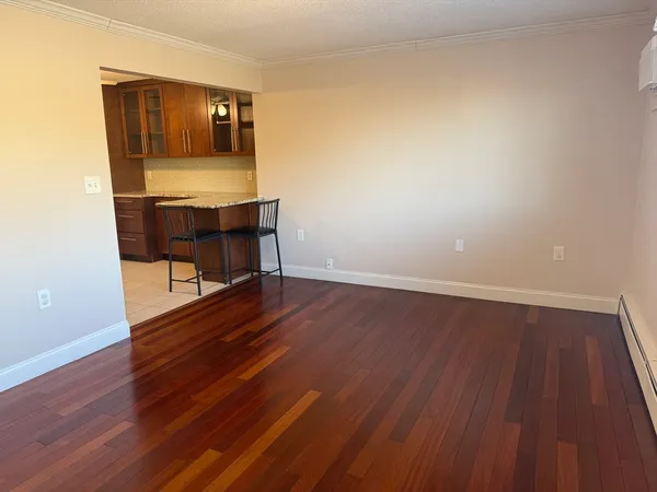 a room with wooden floor and furniture