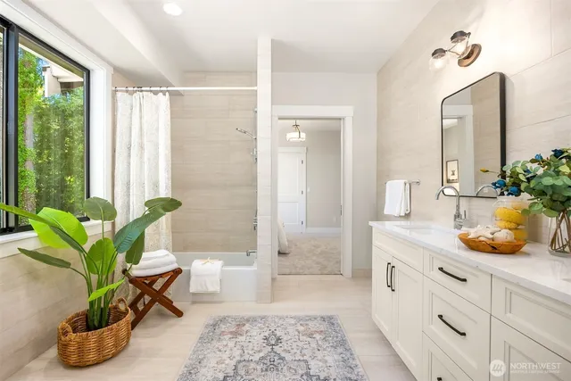 a living room with furniture and a potted plant