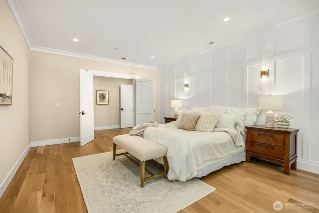 a bedroom with a bed and lamp