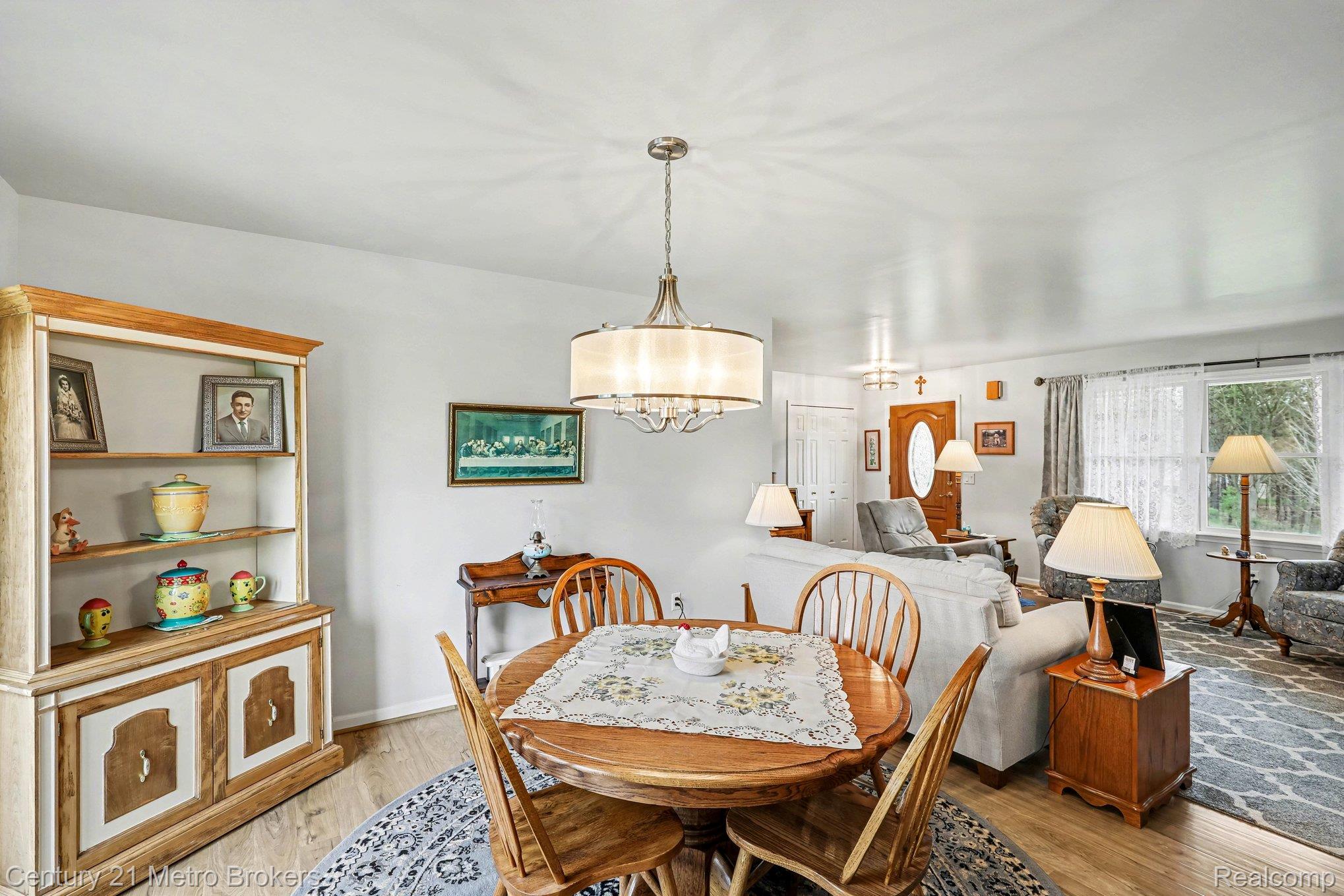 3861 5 Lakes Road Lapeer, MI 48446 - Photo 12 of 30 Dining space featuring light wood-style flooring and baseboards