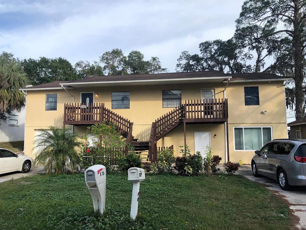 8124 Cormel Street Port Richey, FL 34668 - Photo 1 of 1 a front view of a house with garden