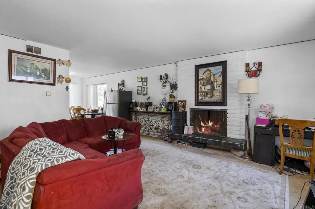 1074 Balour Drive Encinitas, CA 92024 - Photo 21 of 37 a living room with furniture and a fireplace