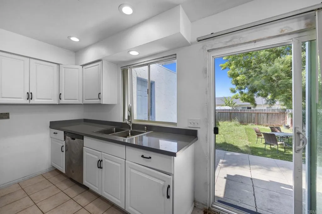 1074 Balour Drive Encinitas, CA 92024 - Photo 25 of 37 a kitchen with a sink and large window