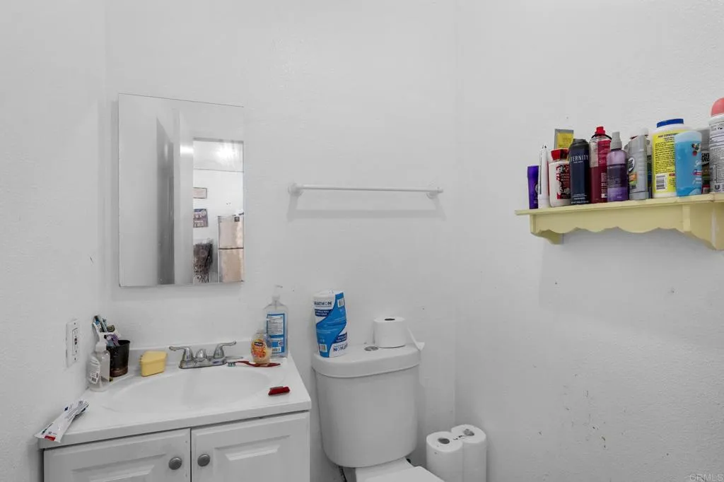 1074 Balour Drive Encinitas, CA 92024 - Photo 26 of 37 a bathroom with a sink toilet and vanity