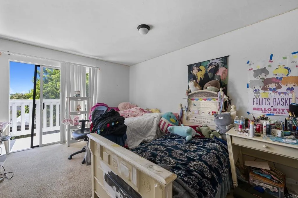 1074 Balour Drive Encinitas, CA 92024 - Photo 29 of 37 a bedroom with furniture and a large window