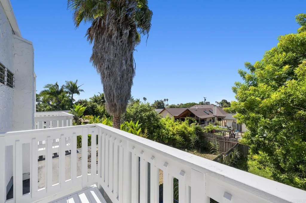 1074 Balour Drive Encinitas, CA 92024 - Photo 32 of 37 a view of a balcony with wooden fence and floor