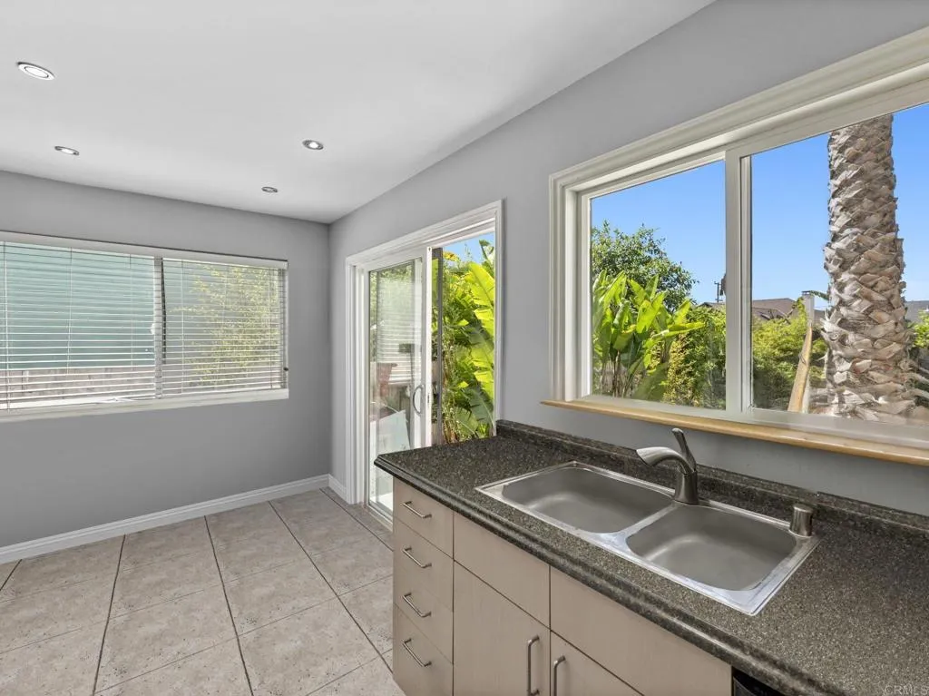 1074 Balour Drive Encinitas, CA 92024 - Photo 10 of 37 a kitchen with a sink and large window
