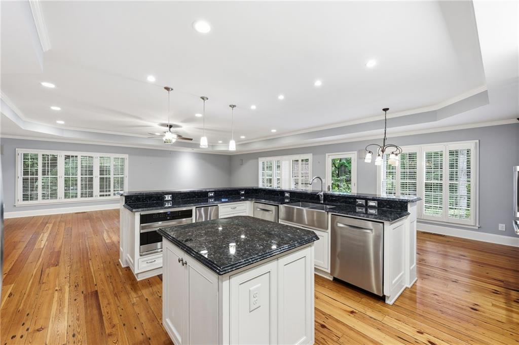 1281 Springdale Road Gainesville, GA 30501 - Photo 39 of 91 a kitchen with stainless steel appliances granite countertop a sink and stove