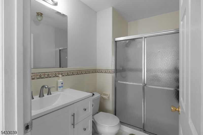 158 Autumn Ridge Road Morris Plains, NJ 07950 - Photo 24 of 26 a bathroom with a sink toilet and shower