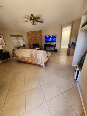 a bedroom with furniture and a chandelier