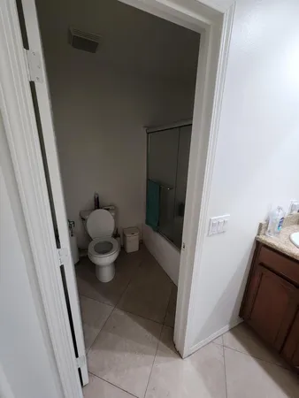 a bathroom with a sink and toilet