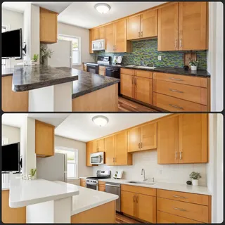 a kitchen with stainless steel appliances kitchen island granite countertop a sink and cabinets