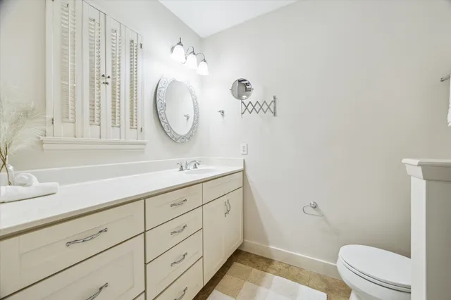 a bedroom with a bed and a mirror