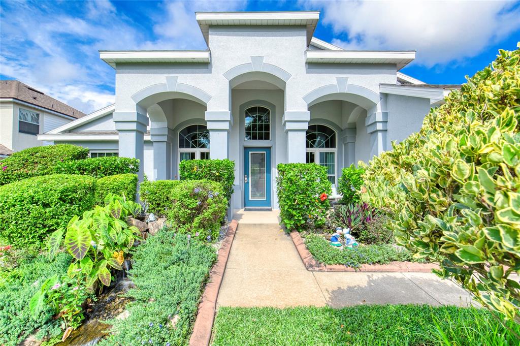 a front view of a house with garden
