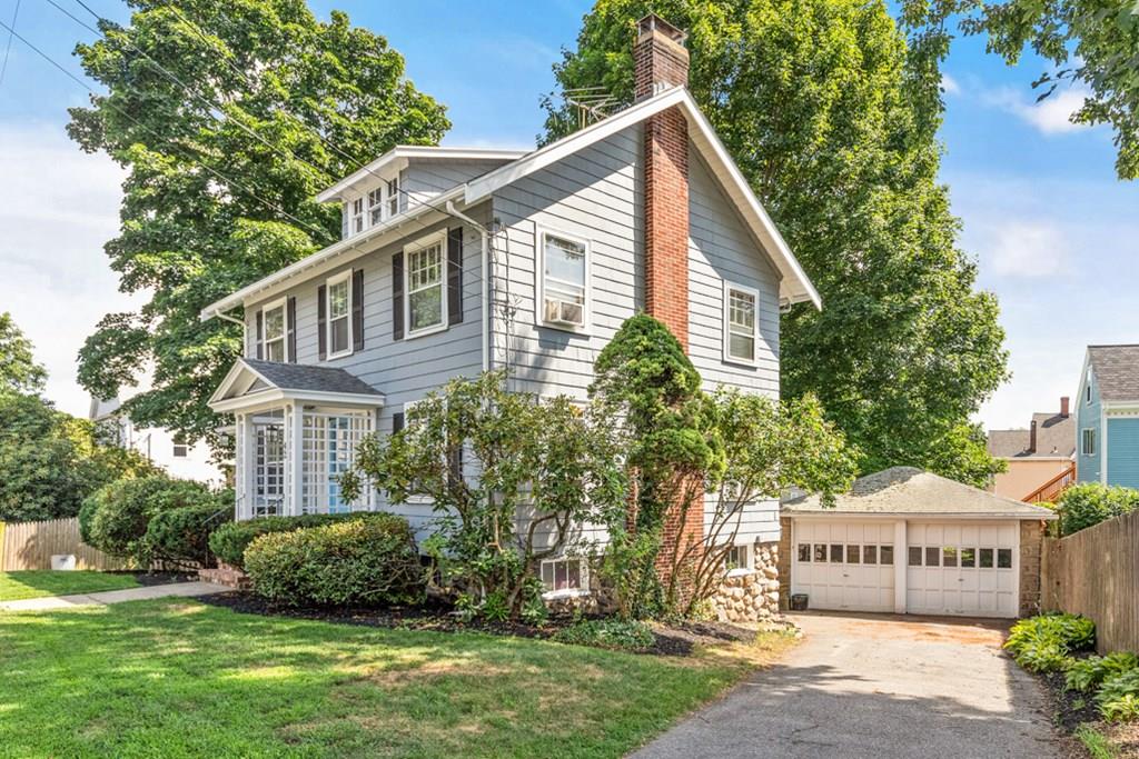 42 Spring Street Wakefield, MA 01880 - Photo 3 of 30 a view of a house with a yard and potted plants