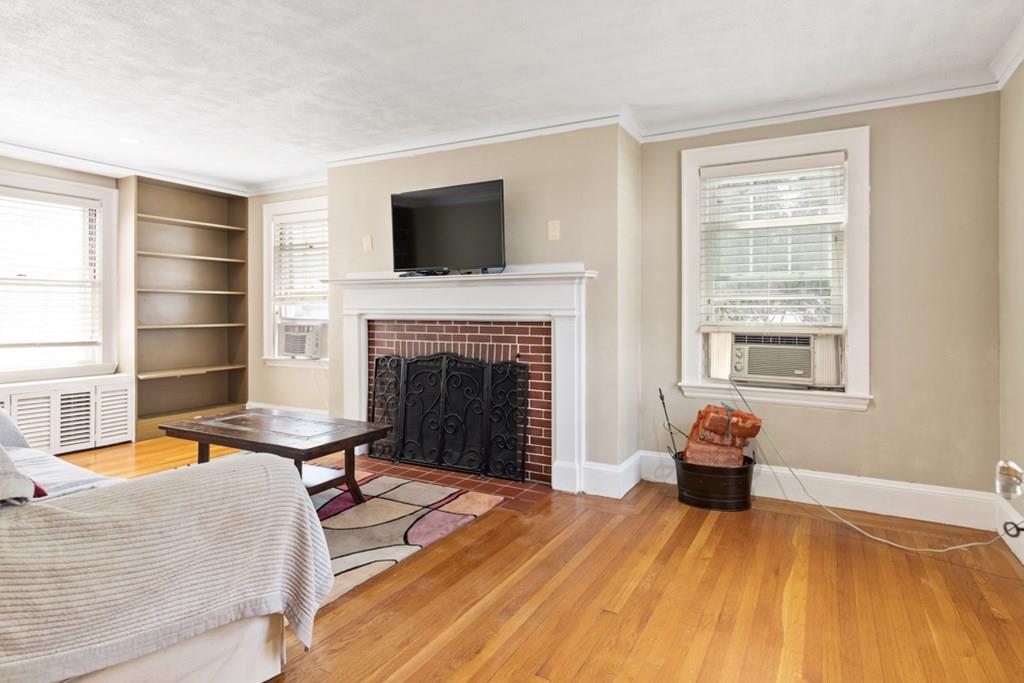 42 Spring Street Wakefield, MA 01880 - Photo 6 of 30 a living room with furniture and a fireplace
