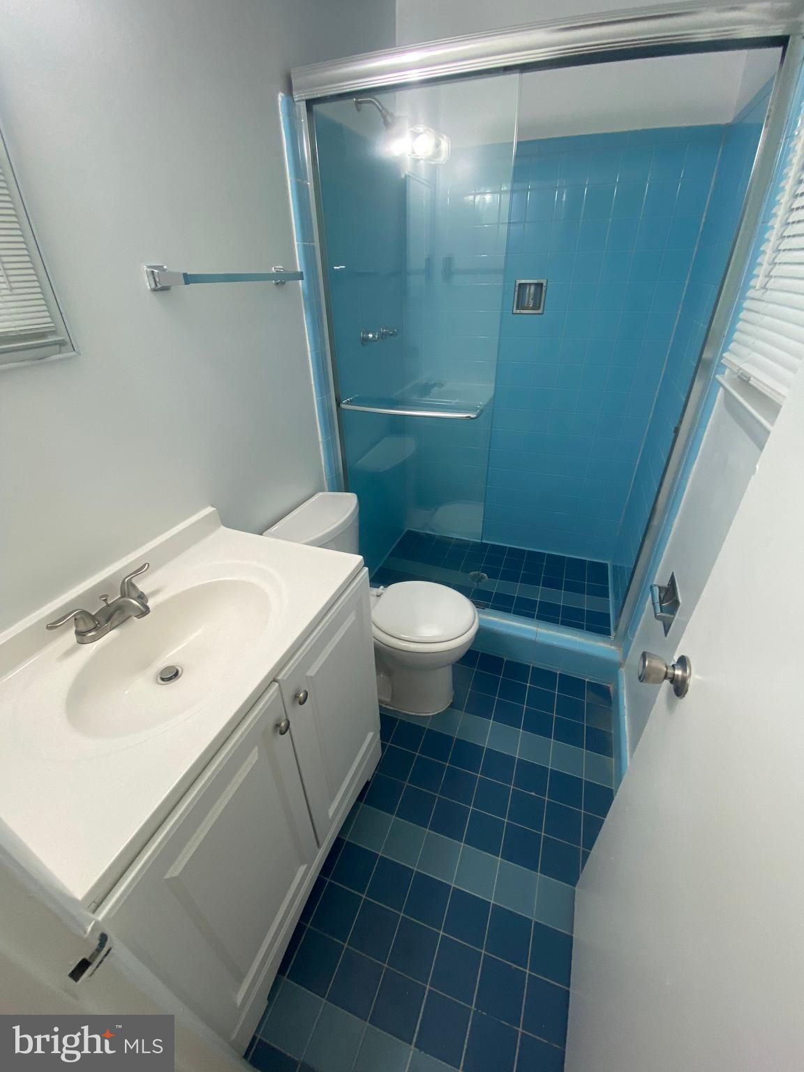 11602 Le Baron Terrace Silver Spring, MD 20902 - Photo 13 of 24 a bathroom with a sink toilet and shower