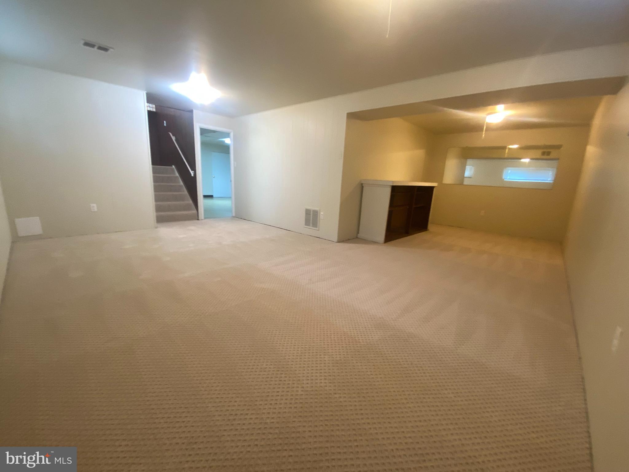 11602 Le Baron Terrace Silver Spring, MD 20902 - Photo 14 of 24 a view of an empty room with a fireplace