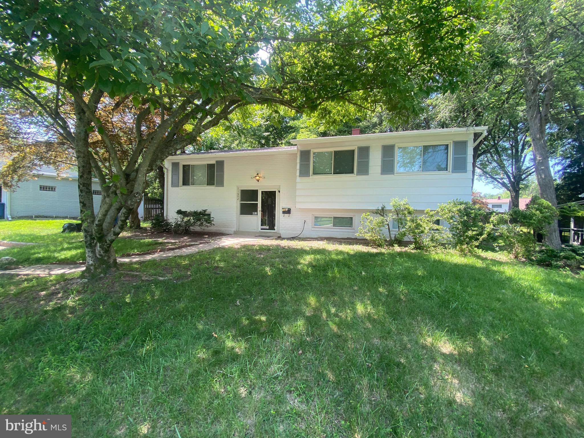 11602 Le Baron Terrace Silver Spring, MD 20902 - Photo 2 of 24 a house that is sitting in the grass