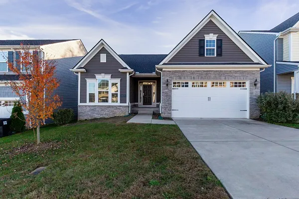 a front view of a house with a yard