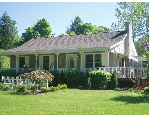 219 Worthington Road Huntington, MA 01050 - Photo 1 of 1 a front view of a house with a yard