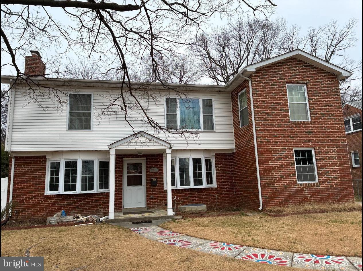 a front view of a house with yard