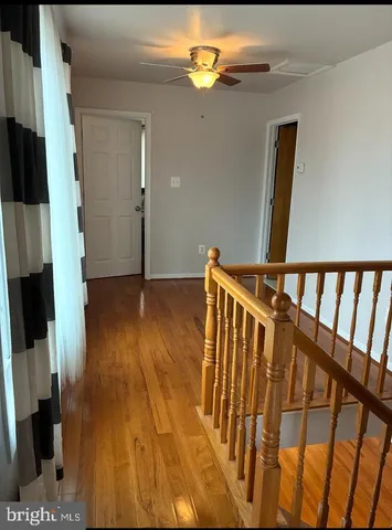 a bathroom with a sink a toilet and shower curtain