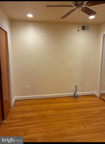 a large kitchen with stainless steel appliances granite countertop a sink and cabinets