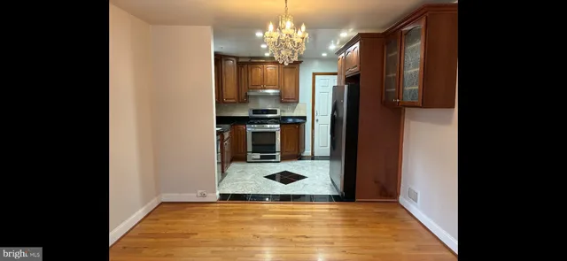 a kitchen with stainless steel appliances granite countertop a stove sink and cabinets